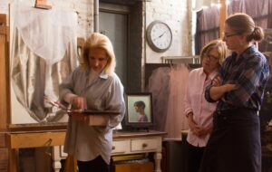 Judith Kudlow teaching group of students at NYK Academy.